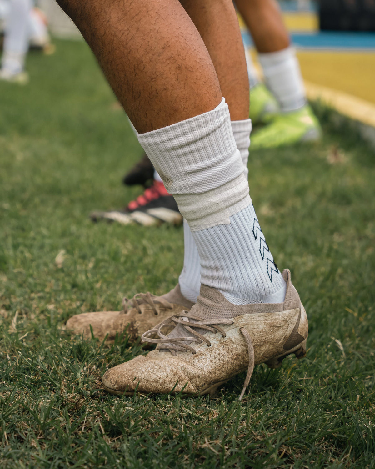 Waarom dragen sporters hoge sokken? Van voetballers tot wielrenners